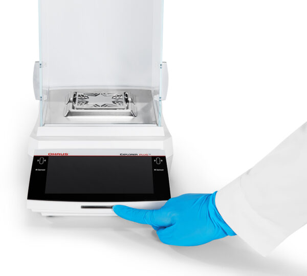 Explorer 2025 model, Semi-Micro Balance, Plus EXP, being turned on, viewed front on, white background.