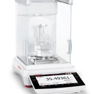 Explorer Semi-Micro Balance Plus EXP being used with beaker and liquid filling, white background