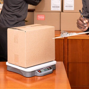 Ohaus 1000 shipping scale with box parcel on top