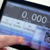 BTT Checkweighing scale touchscreen representative image to show operation of device with human finder using the touchscreen.